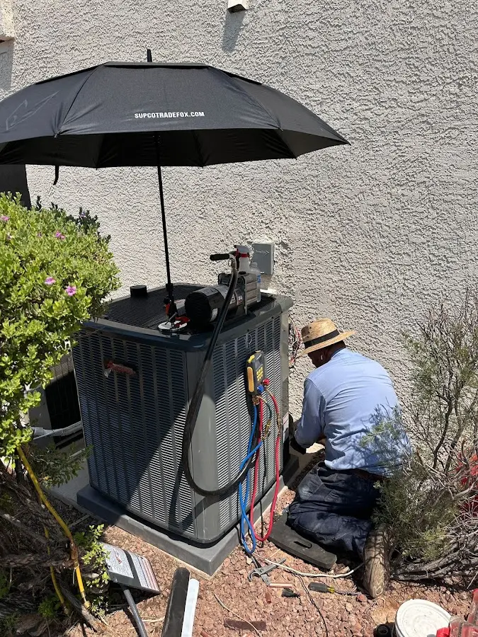 HVAC technician performing outdoor AC maintenance in Timonium